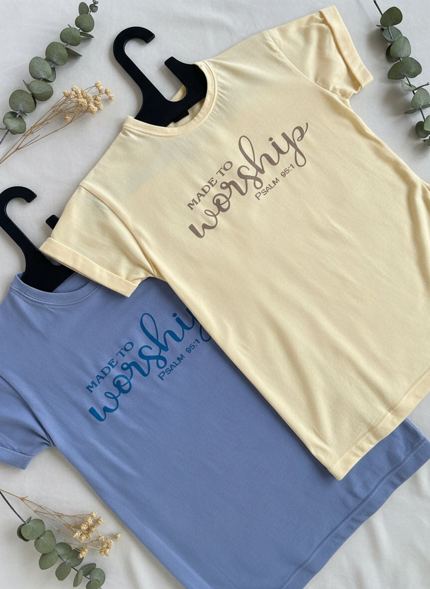 White and blue t-shirts with 'Myshoom' branding on a textured surface.