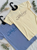White and blue t-shirts with 'Myshoom' branding on a textured surface.