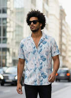 Man wearing a floral shirt on a city street