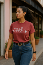 Woman wearing a red 'Made to Worship' t-shirt walking outdoors.