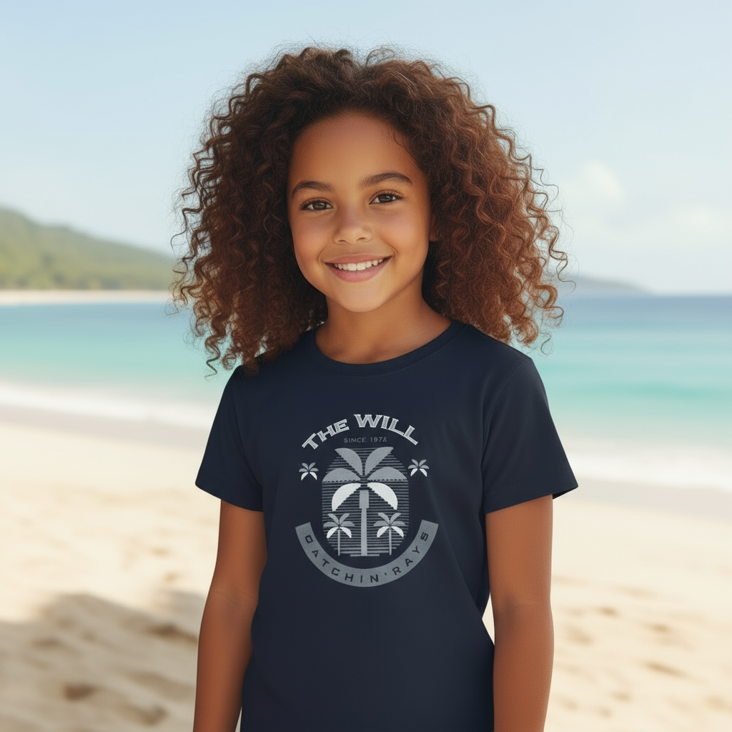 Child wearing a navy blue t-shirt with a palm tree design on a beach