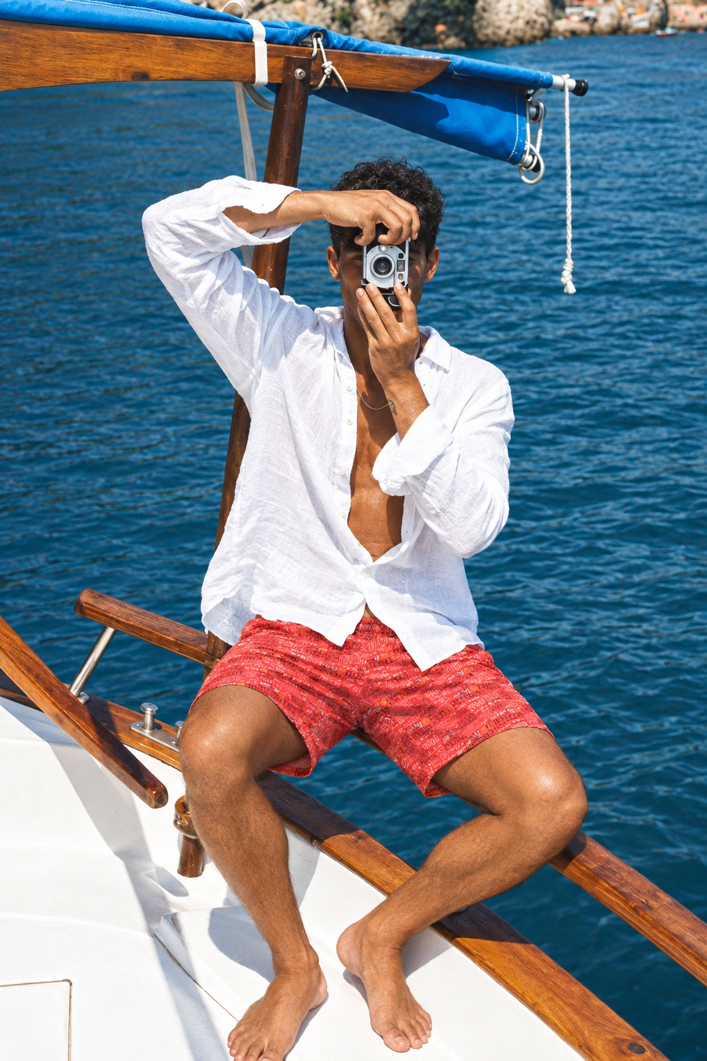 Coral-red shorts boat portrait