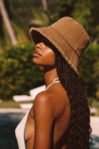 Distressed camel bucket hat poolside portrait