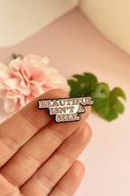 Hand hold lifestyle - Beautiful Isn't A Size pin