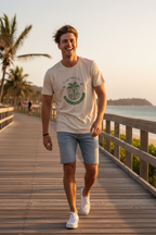 Man walking on tropical boardwalk wearing The Will tee