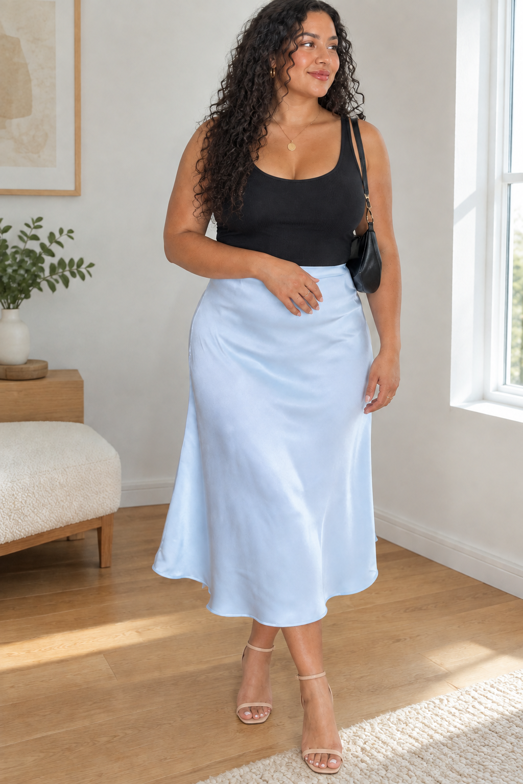 XL model in the baby blue satin skirt with nude strappy heels